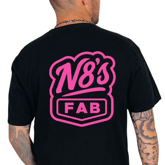 Black t-shirt with pink 'N8's FAB' logo on the back, worn by a person.